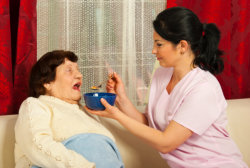 nurse feeding elder